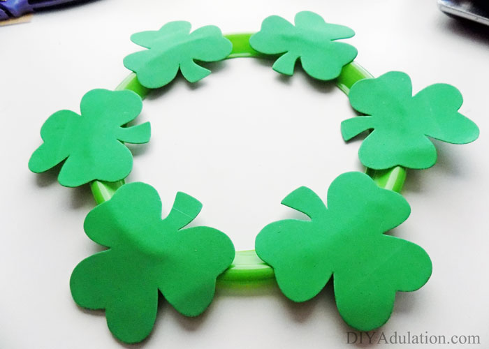 Holiday decor doesn't have to break the bank. Find out how to make this awesome dollar store St. Patrick's wreath for the change in your couch!