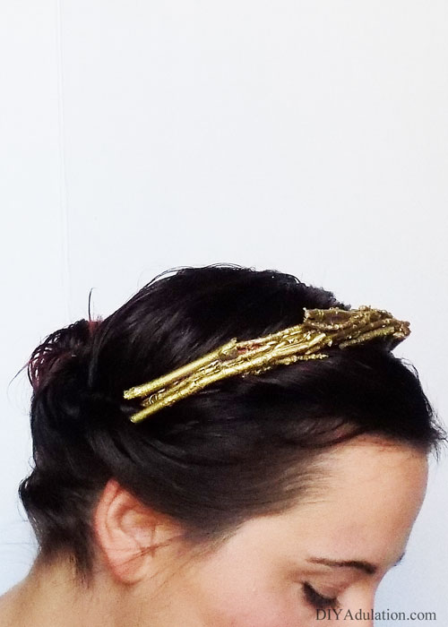 Take your hair from blah to wow easily with this DIY golden twig crown. Use it to instantly upgrade your day outfit or weave it with a glam holiday up-do.