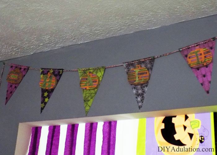 Let's get this DIY Halloween shindig back on the road! Find out how to make this super sweet DIY pumpkin banner for easy and beautiful party decor!