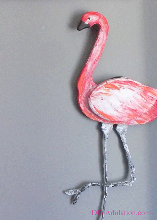 See the newest makeover at the Thrift Store Decor Upcycle Challenge! Turn an ugly thrift store goose into an awesome pink flamingo wall hanging.