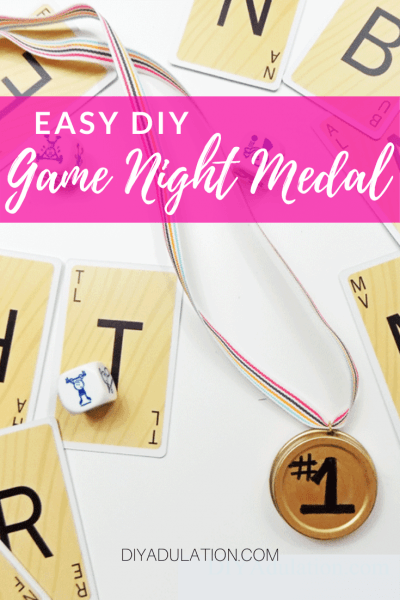 Game Night Medal next to Cards and Die with text overlay - Easy DIY Game Night Medal - DIY Adulation