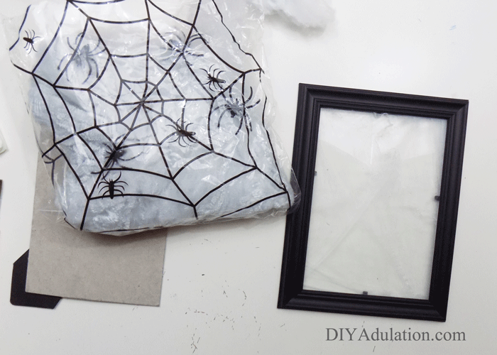 This DIY spooky spider web lantern is so easy to make and budget-friendly you will want to make several different size ones to create a spooky vignette. #ad