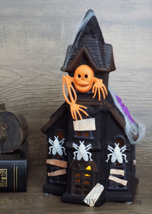 This DIY haunted house makeover will have you running to the thrift store to find your own Christmas statue! Find out how to make it now!