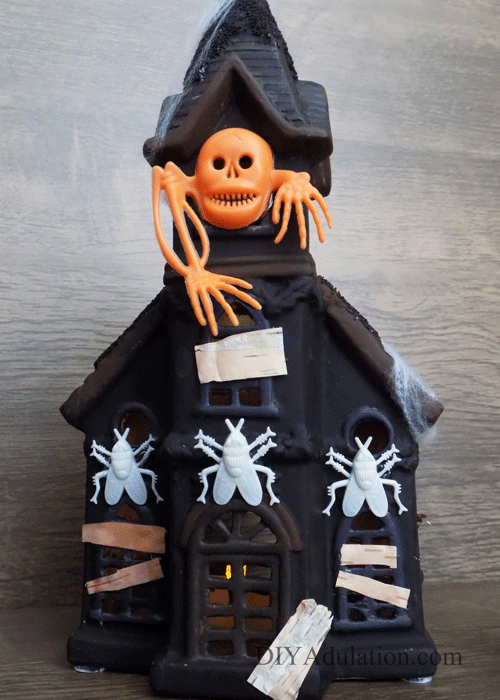 This DIY haunted house makeover will have you running to the thrift store to find your own Christmas statue! Find out how to make it now!