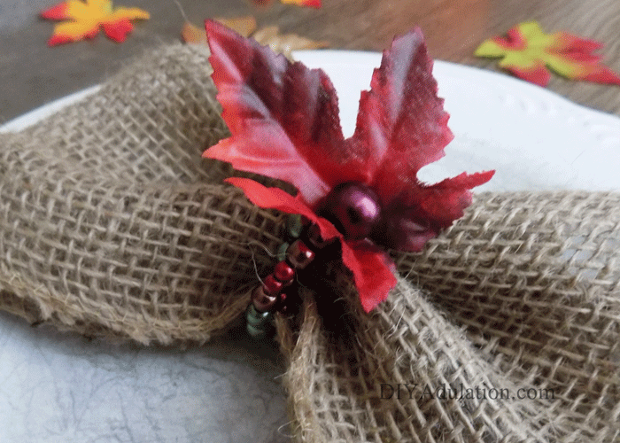 Dress up your holiday place settings without fancy china. These DIY beaded autumn leaves napkin rings instantly add an elegant and festive touch.