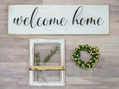 Wooden welcome home sign with farmhouse frame and green wreath below