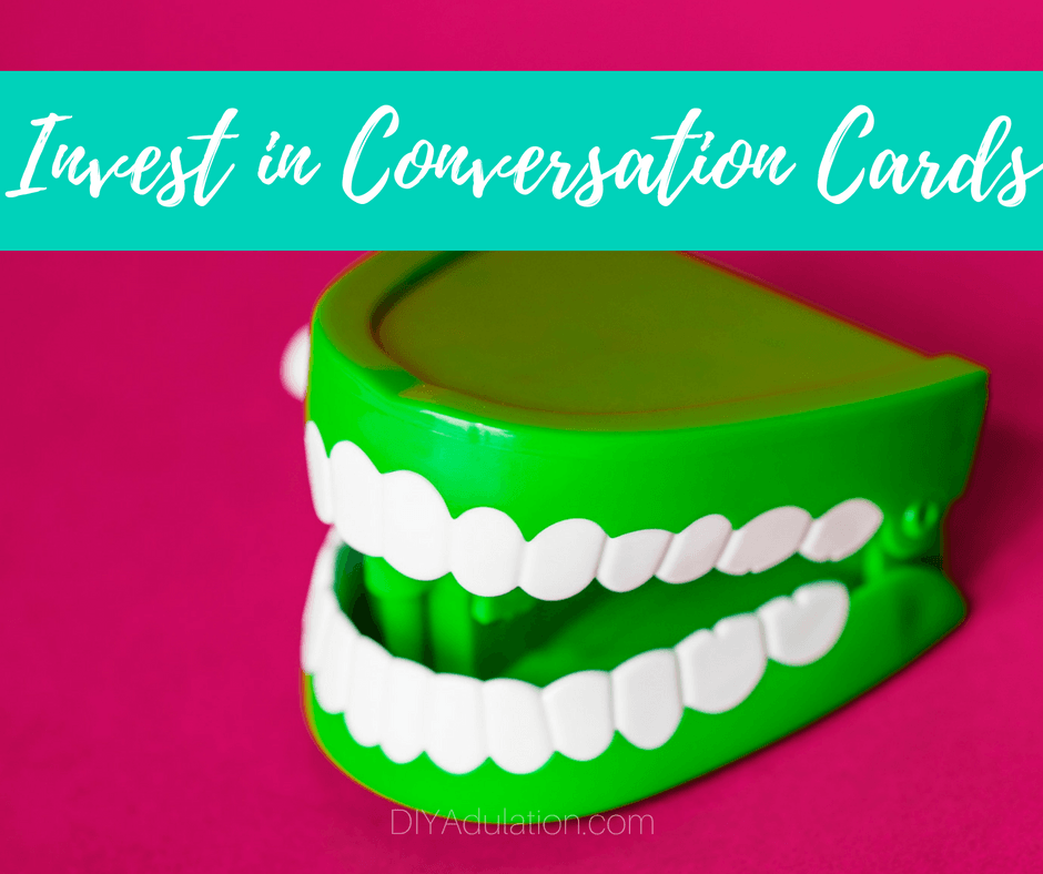 Green Chattering Teeth toy with text overlay: Invest in Conversation Cards