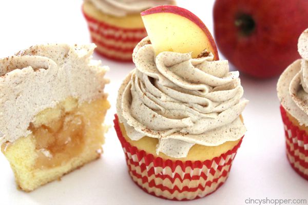 Cupcake with icing on top and an apple slice