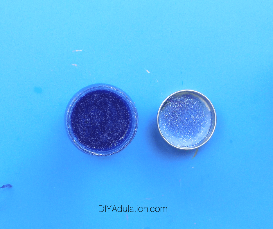Blue Glitter Glue and Water Mixed in Jar