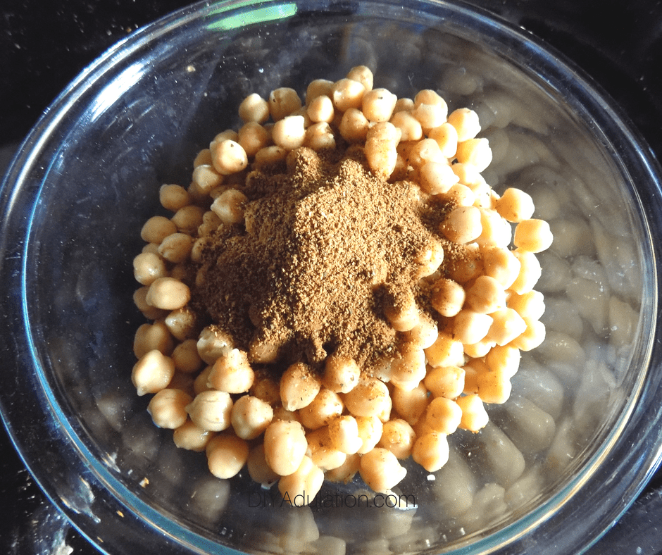Chickpeas and Seasoning in Glass Mixing Bowl
