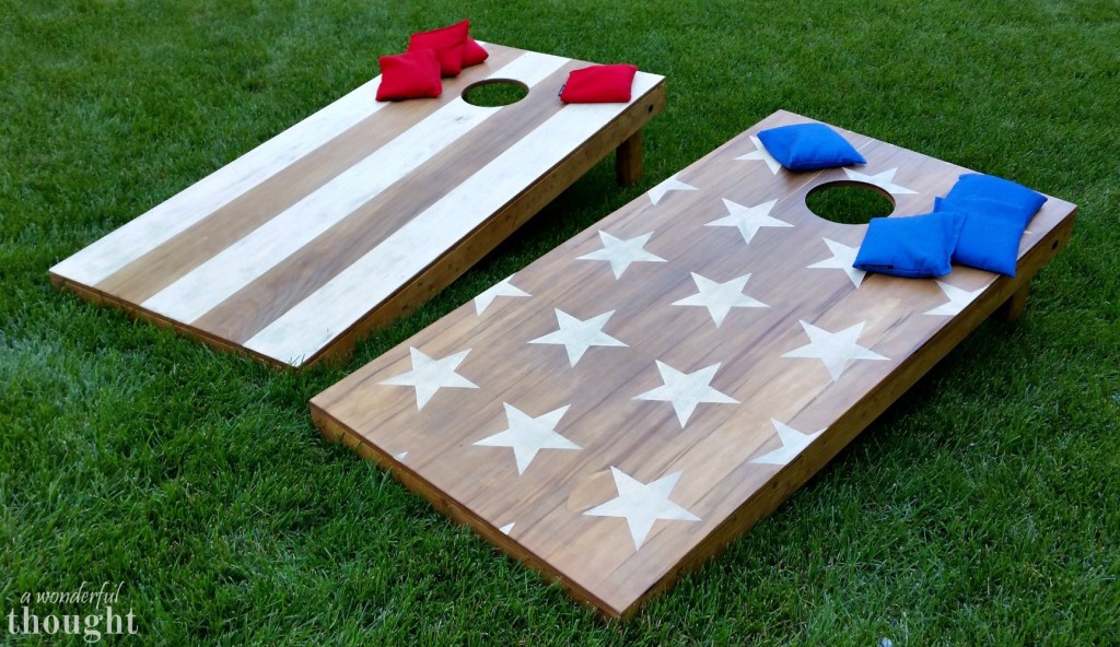 Stars and stripes wooden cornhole boards on yard