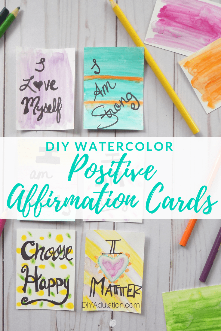 Positive Affirmation Cards Next to Pencils and Watercolor Cards with Text Overlay - DIY Watercolor Positive Affirmation Cards