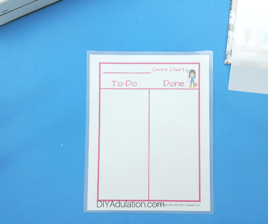 Printed Pink Chore Chart Inside of Laminating Folder