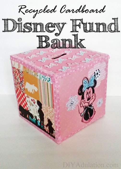 Pink Square bank with text overlay - Recycled Cardboard Disney Fund Bank