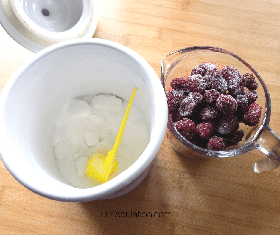 Sugar Container and Frozen Blackberries in Measuring Cup
