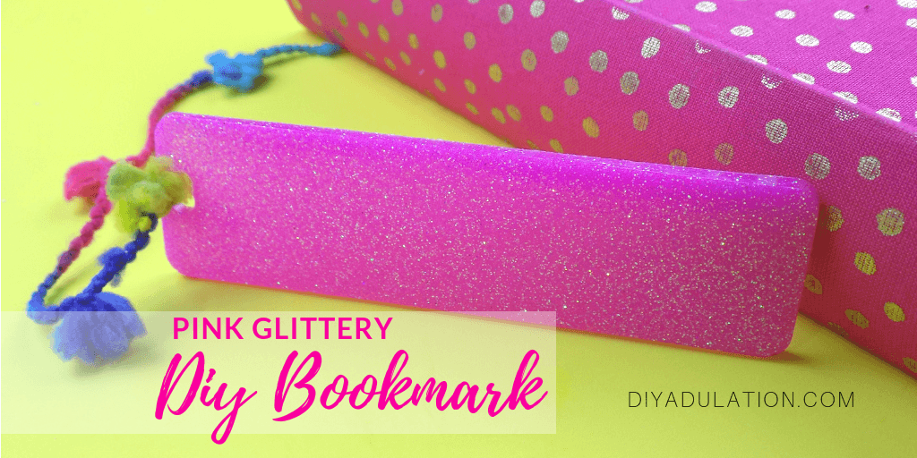 Close Up of Tasseled Pink Glitter Bookmark with text overlay - Pink Glittery DIY Bookmark