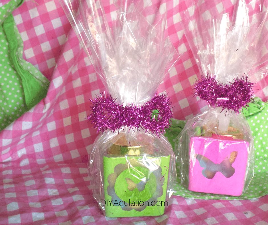 Wrapped Butterfly Votive Holder Gifts on Pink and Green Background