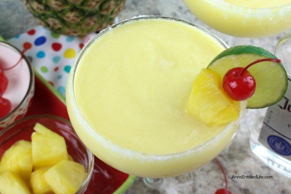 Frozen pineapple margarita with fruit garnish