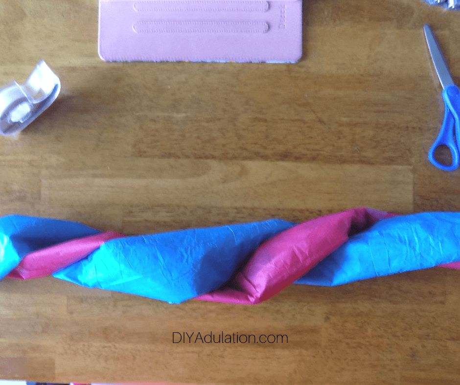 Blue and Pink Paper Wrapped Together