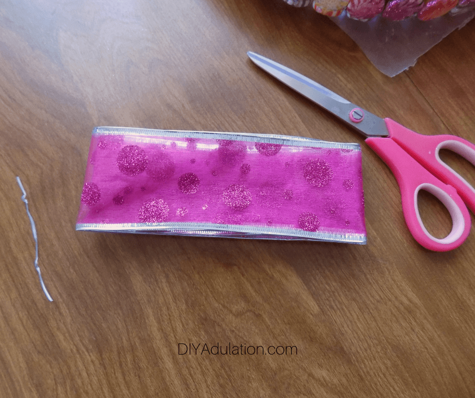 Folded Pink Glitter Ribbon Cut from Spool