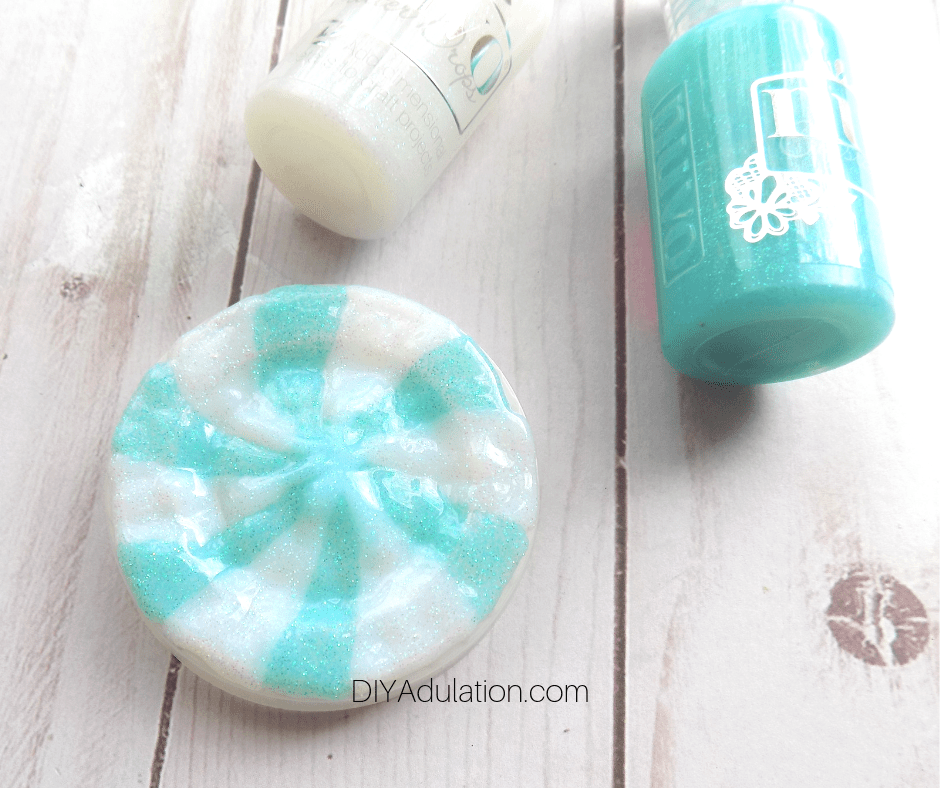 White and Teal Glitter Glue on Condiment Container Lid