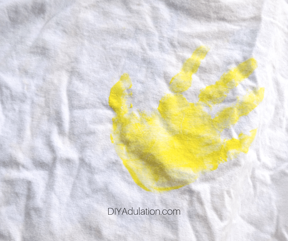 Yellow Hand Print on White T-Shirt