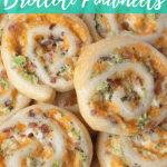 Close up of Stack of Pinwheels with text overlay - Cheddar Bacon and Broccoli Pinwheels