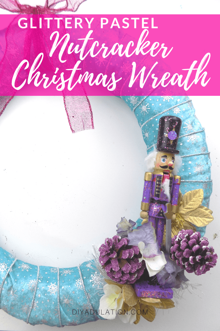 Nutcracker and Floral Elements on Wreath with text overlay - Glittery Pastel Nutcracker Christmas Wreath