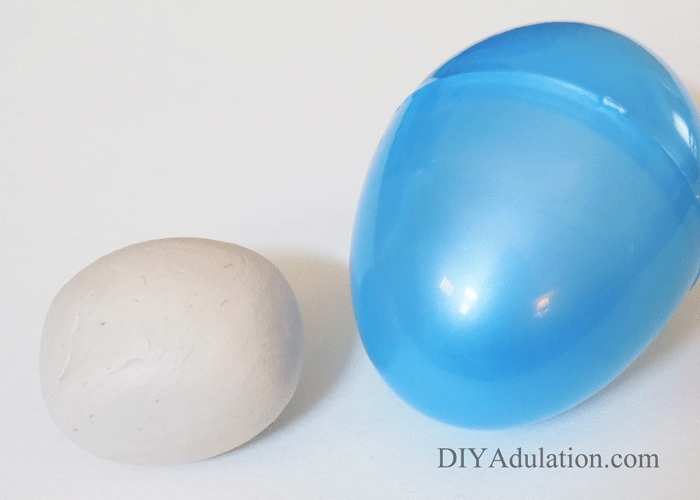 Ball of clay next to plastic egg