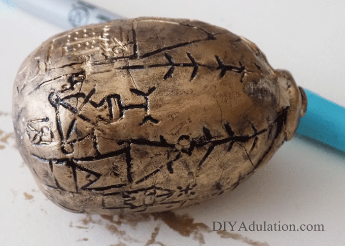 Close up of black paint on carved egg